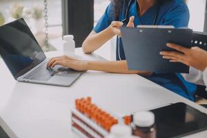 biochemical research scientist team working with microscope for coronavirus vaccine development in pharmaceutical research labolatory, selective focus photo