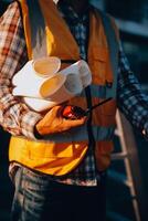 Team Construction or engineering group and worker. Teamwork and determination to succeed. Safety hard hat to prevent accident while working Transport and Container Team. Concept Restart and new Normal photo