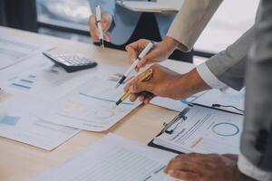 Finance manager meeting discussing company growth project success financial statistics, professional investor working start up project for strategy plan with document, laptop and digital tablet. photo