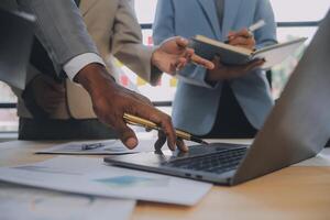 Finance manager meeting discussing company growth project success financial statistics, professional investor working start up project for strategy plan with document, laptop and digital tablet. photo