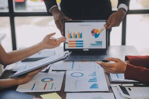 Finance manager meeting discussing company growth project success financial statistics, professional investor working start up project for strategy plan with document, laptop and digital tablet. photo