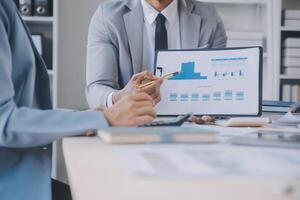 Finance manager meeting discussing company growth project success financial statistics, professional investor working start up project for strategy plan with document, laptop and digital tablet. photo