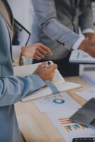 Finance manager meeting discussing company growth project success financial statistics, professional investor working start up project for strategy plan with document, laptop and digital tablet. photo