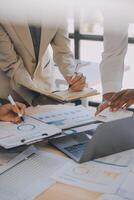 Finance manager meeting discussing company growth project success financial statistics, professional investor working start up project for strategy plan with document, laptop and digital tablet. photo