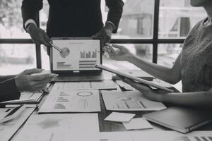 Finance manager meeting discussing company growth project success financial statistics, professional investor working start up project for strategy plan with document, laptop and digital tablet. photo