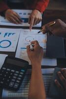 Finance manager meeting discussing company growth project success financial statistics, professional investor working start up project for strategy plan with document, laptop and digital tablet. photo