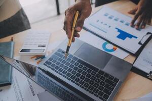 Finance manager meeting discussing company growth project success financial statistics, professional investor working start up project for strategy plan with document, laptop and digital tablet. photo