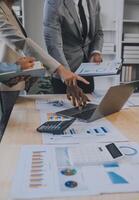 Finance manager meeting discussing company growth project success financial statistics, professional investor working start up project for strategy plan with document, laptop and digital tablet. photo