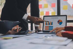 Finance manager meeting discussing company growth project success financial statistics, professional investor working start up project for strategy plan with document, laptop and digital tablet. photo