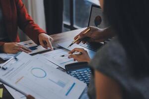 Finance manager meeting discussing company growth project success financial statistics, professional investor working start up project for strategy plan with document, laptop and digital tablet. photo