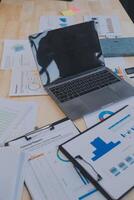 Finance manager meeting discussing company growth project success financial statistics, professional investor working start up project for strategy plan with document, laptop and digital tablet. photo
