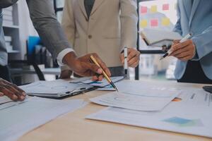 Finance manager meeting discussing company growth project success financial statistics, professional investor working start up project for strategy plan with document, laptop and digital tablet. photo