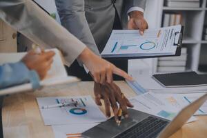 Finance manager meeting discussing company growth project success financial statistics, professional investor working start up project for strategy plan with document, laptop and digital tablet. photo