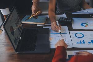 Finance manager meeting discussing company growth project success financial statistics, professional investor working start up project for strategy plan with document, laptop and digital tablet. photo