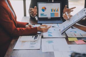 Finance manager meeting discussing company growth project success financial statistics, professional investor working start up project for strategy plan with document, laptop and digital tablet. photo