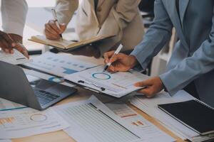 Finance manager meeting discussing company growth project success financial statistics, professional investor working start up project for strategy plan with document, laptop and digital tablet. photo