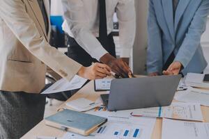 Finance manager meeting discussing company growth project success financial statistics, professional investor working start up project for strategy plan with document, laptop and digital tablet. photo