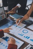 Finance manager meeting discussing company growth project success financial statistics, professional investor working start up project for strategy plan with document, laptop and digital tablet. photo