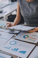 Finance manager meeting discussing company growth project success financial statistics, professional investor working start up project for strategy plan with document, laptop and digital tablet. photo