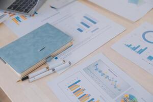 Finance manager meeting discussing company growth project success financial statistics, professional investor working start up project for strategy plan with document, laptop and digital tablet. photo