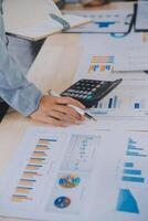 Finance manager meeting discussing company growth project success financial statistics, professional investor working start up project for strategy plan with document, laptop and digital tablet. photo