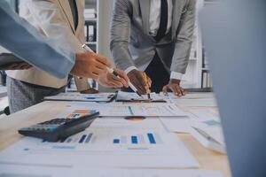 Finance manager meeting discussing company growth project success financial statistics, professional investor working start up project for strategy plan with document, laptop and digital tablet. photo