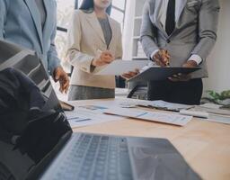Finance manager meeting discussing company growth project success financial statistics, professional investor working start up project for strategy plan with document, laptop and digital tablet. photo