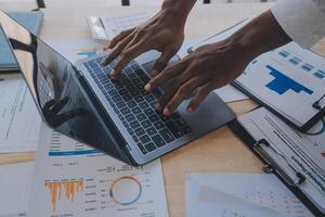 Finance manager meeting discussing company growth project success financial statistics, professional investor working start up project for strategy plan with document, laptop and digital tablet. photo
