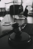 Group of experienced attorneys and lawyers giving consultation to client, helping with difficult lawsuit, explaining legal procedures and discussing agreement terms. Law services and support concept photo