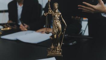 Group of experienced attorneys and lawyers giving consultation to client, helping with difficult lawsuit, explaining legal procedures and discussing agreement terms. Law services and support concept photo