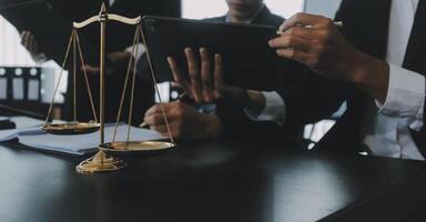 Group of experienced attorneys and lawyers giving consultation to client, helping with difficult lawsuit, explaining legal procedures and discussing agreement terms. Law services and support concept photo