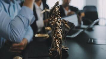 Group of experienced attorneys and lawyers giving consultation to client, helping with difficult lawsuit, explaining legal procedures and discussing agreement terms. Law services and support concept photo