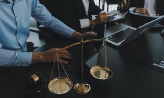 Group of experienced attorneys and lawyers giving consultation to client, helping with difficult lawsuit, explaining legal procedures and discussing agreement terms. Law services and support concept photo