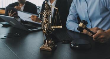 Group of experienced attorneys and lawyers giving consultation to client, helping with difficult lawsuit, explaining legal procedures and discussing agreement terms. Law services and support concept photo