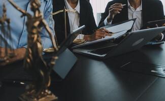 Group of experienced attorneys and lawyers giving consultation to client, helping with difficult lawsuit, explaining legal procedures and discussing agreement terms. Law services and support concept photo