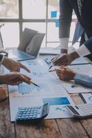 Co working conference, Business team meeting present, investor colleagues discussing new plan financial graph data on office table with laptop and digital tablet, Finance, accounting, investment. photo