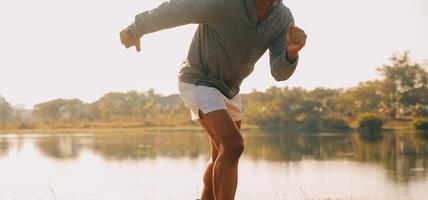 Athlete runner feet running on road photo