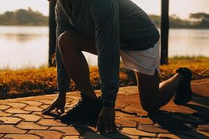 Athlete runner feet running on road photo