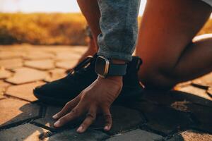 Athlete runner feet running on road photo