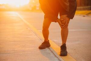 Athlete runner feet running on road,Jogging concept at outdoors. Man running for exercise.Athlete runner feet running on road, Jogging concept at outdoors. Man running for exercise. photo