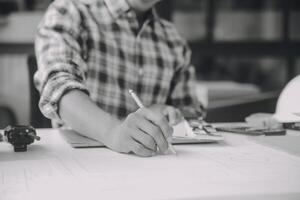 Construction and structure concept of Engineer or architect meeting for project working with partner and engineering tools on model building and blueprint in working site, contract for both companies. photo