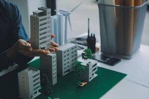 Construction and structure concept of Engineer or architect meeting for project working with partner and engineering tools on model building and blueprint in working site, contract for both companies. photo