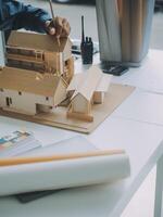 Construction and structure concept of Engineer or architect meeting for project working with partner and engineering tools on model building and blueprint in working site, contract for both companies. photo