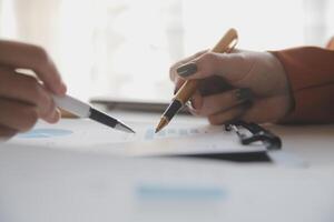Team of business people working together in the meeting room office, teamwork background charts and graphs banner, double exposure successful teamwork,business planning concept. photo