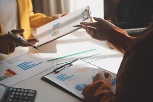 Team of business people working together in the meeting room office, teamwork background charts and graphs banner, double exposure successful teamwork,business planning concept. photo