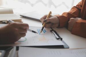 Team of business people working together in the meeting room office, teamwork background charts and graphs banner, double exposure successful teamwork,business planning concept. photo