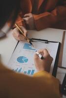 Team of business people working together in the meeting room office, teamwork background charts and graphs banner, double exposure successful teamwork,business planning concept. photo