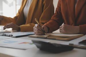 Team of business people working together in the meeting room office, teamwork background charts and graphs banner, double exposure successful teamwork,business planning concept. photo