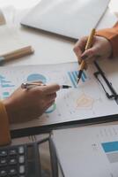 Team of business people working together in the meeting room office, teamwork background charts and graphs banner, double exposure successful teamwork,business planning concept. photo