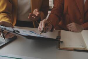 Team of business people working together in the meeting room office, teamwork background charts and graphs banner, double exposure successful teamwork,business planning concept. photo